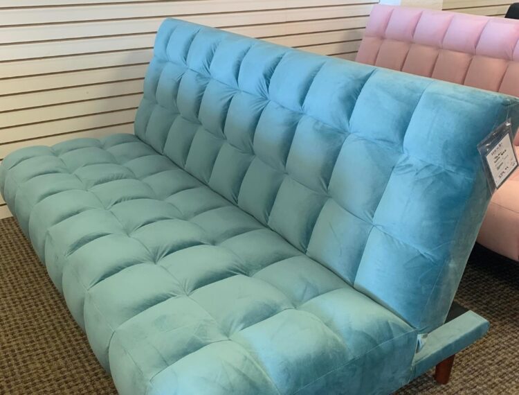 Gently used turquoise couch at Revivals Store