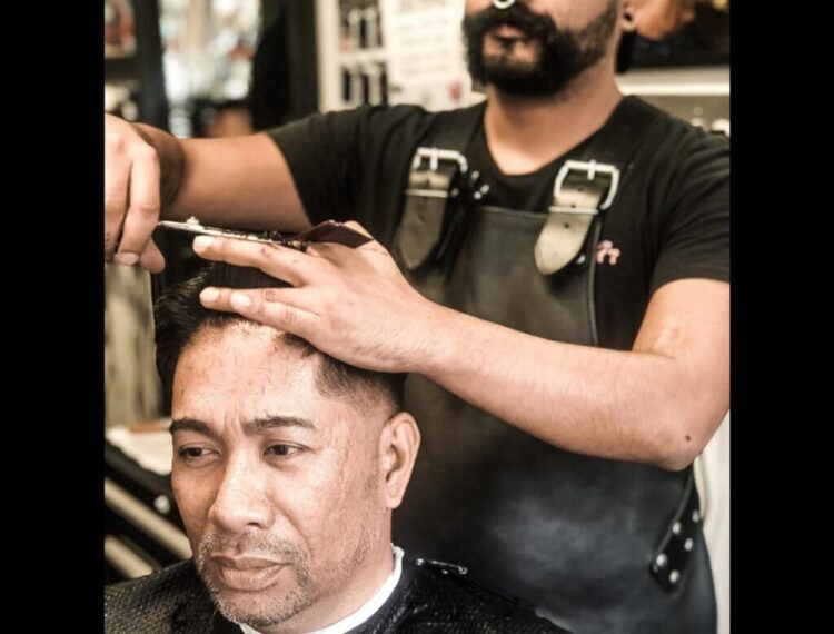man getting his haircut