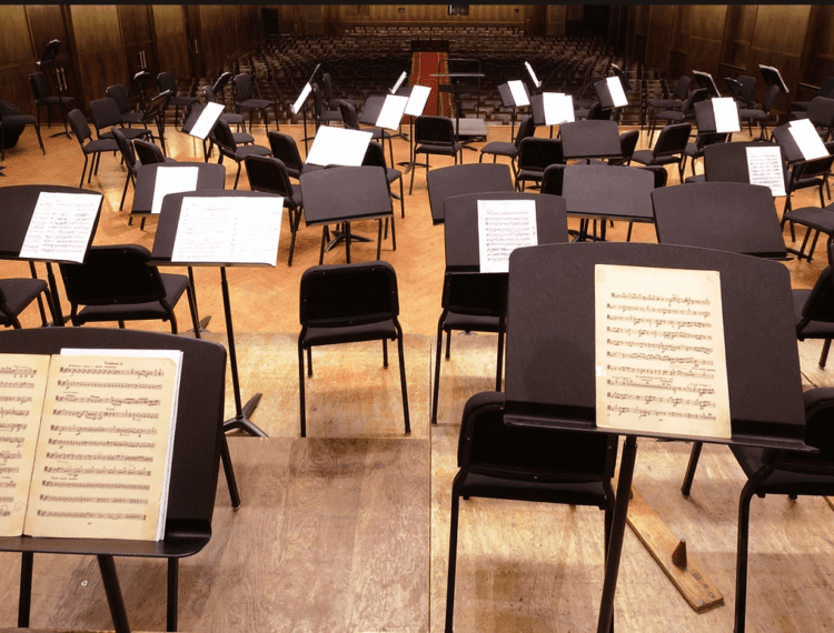 seats on stage for musical performance