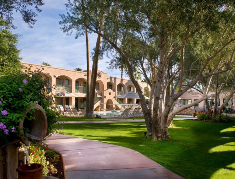 Desert Sun Resort exterior with view of pool