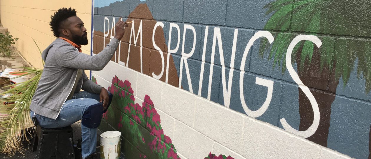 Tysen Knight painting a Palm Springs mural