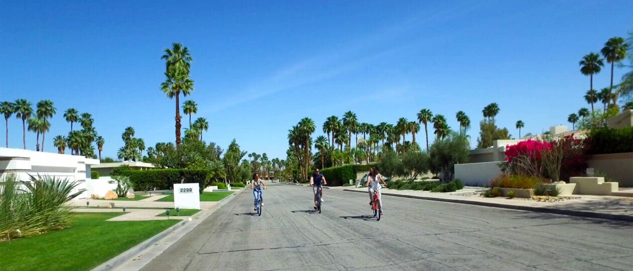 Three people taking bike ride through South Palm Springs