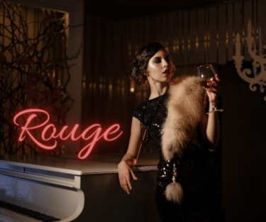 A woman in a vintage black sequin dress with a fur stole leans on a piano, holding a glass of wine, with a neon sign reading "Rouge" in the background.